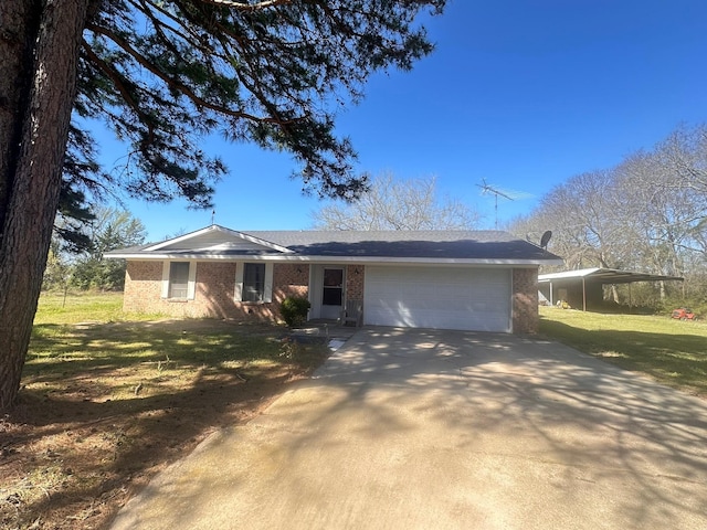 single story home featuring a front lawn, an attached garage, brick siding, and concrete driveway