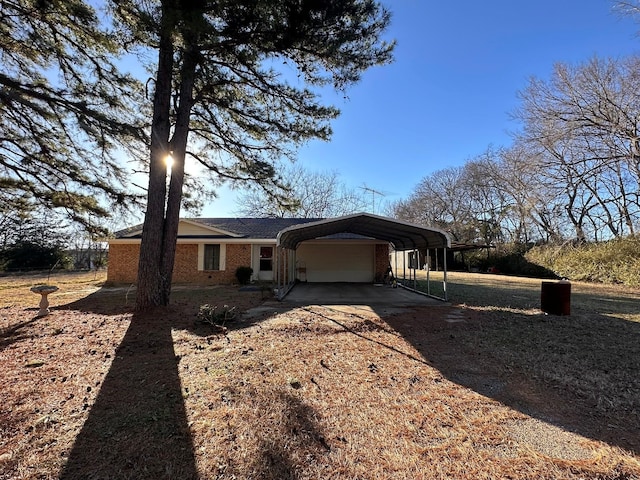 view of front of property with a carport and a garage