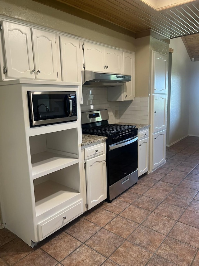 kitchen featuring white cabinetry, wood ceiling, tasteful backsplash, appliances with stainless steel finishes, and light stone countertops