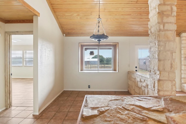 interior space featuring a healthy amount of sunlight, tile patterned flooring, and wooden ceiling