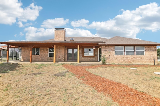 rear view of house with a patio