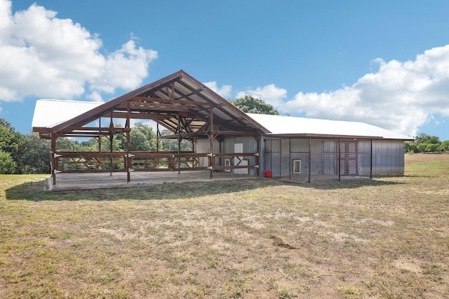 surrounding community with a yard and an outdoor structure