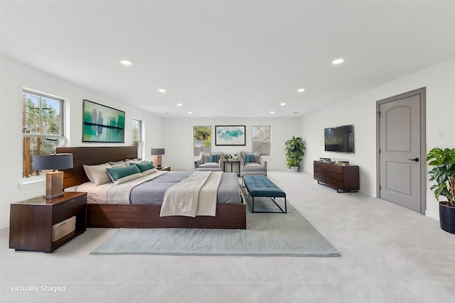 bedroom featuring recessed lighting and multiple windows