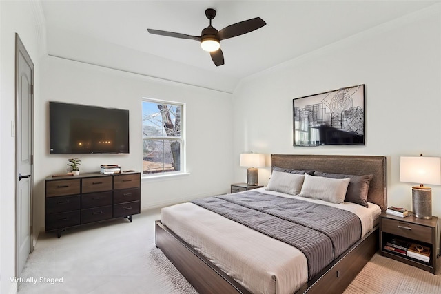 bedroom featuring light carpet and ceiling fan