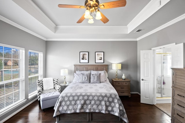 bedroom featuring a raised ceiling, crown molding, and dark hardwood / wood-style floors