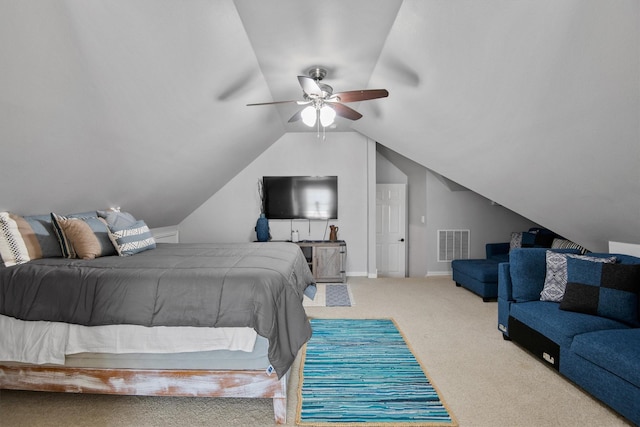 bedroom with ceiling fan, carpet flooring, and vaulted ceiling