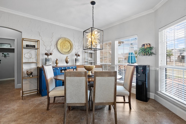 dining space featuring a notable chandelier, a wealth of natural light, and ornamental molding