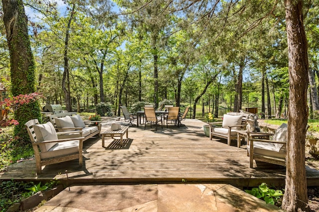 exterior space featuring a wooden deck and an outdoor living space