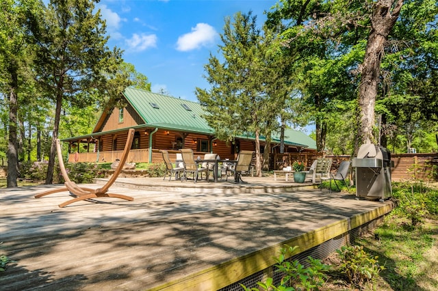 view of home's community featuring a wooden deck