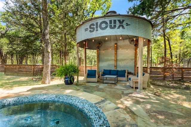 exterior space featuring an outdoor living space and a gazebo