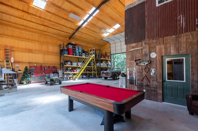 recreation room with pool table, concrete floors, and a workshop area