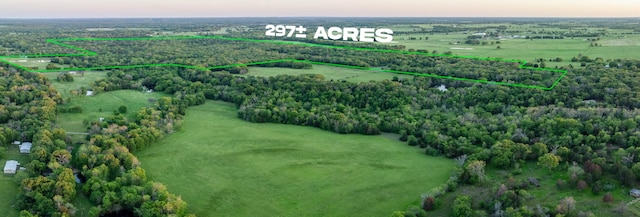 birds eye view of property with a rural view