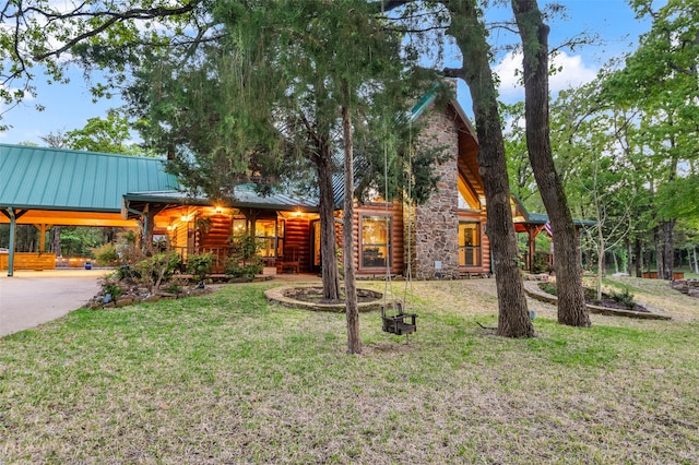 cabin with a front yard