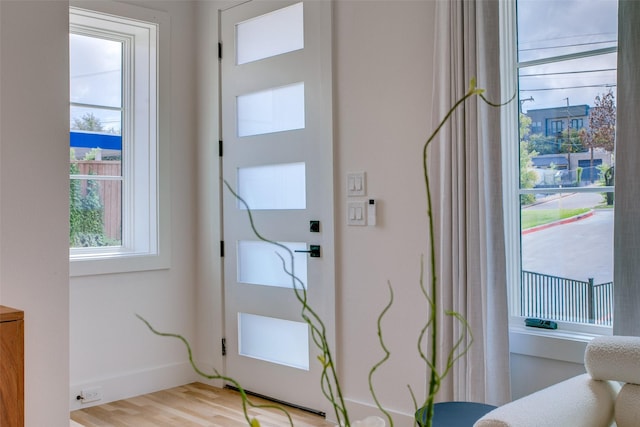 doorway to outside with light wood-type flooring