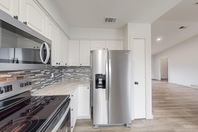 kitchen featuring white cabinetry, appliances with stainless steel finishes, and light hardwood / wood-style floors