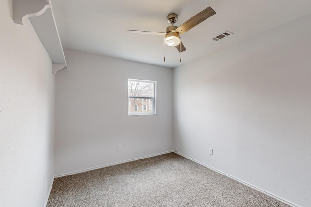 empty room featuring ceiling fan and carpet flooring