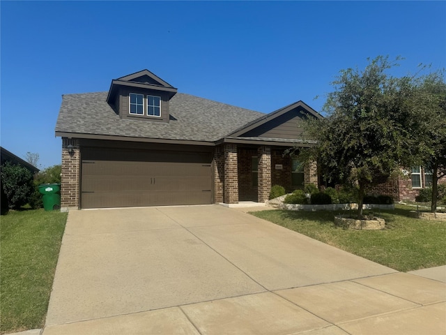 view of front of house with a garage and a front yard