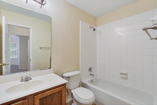 full bathroom featuring vanity, toilet, and tiled shower / bath combo