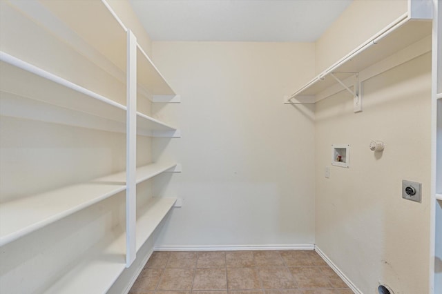 washroom with washer hookup, hookup for a gas dryer, and electric dryer hookup