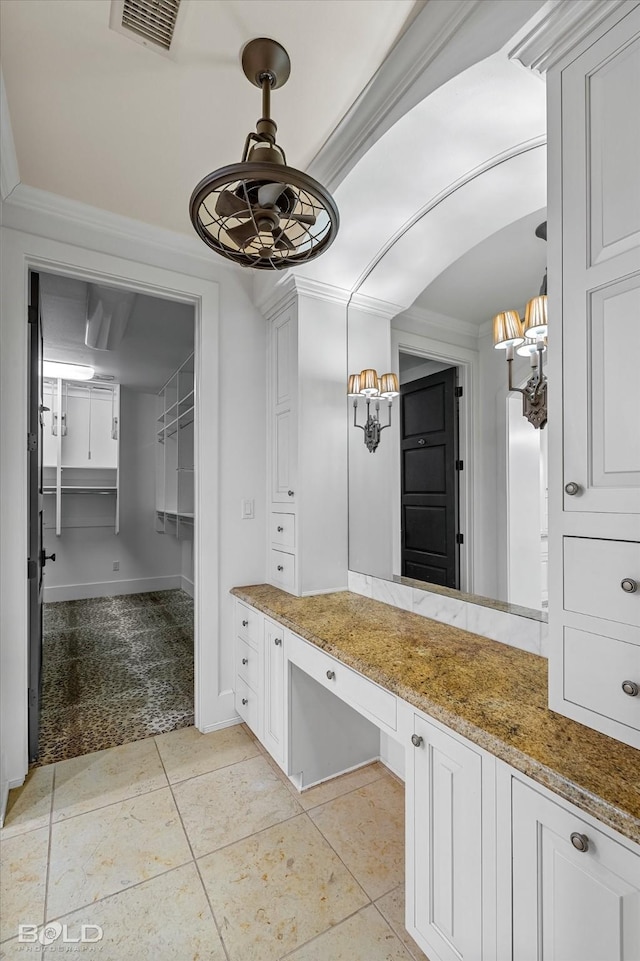 bathroom featuring tile patterned flooring and ornamental molding