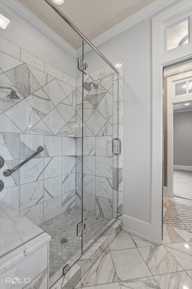 bathroom featuring an enclosed shower and ornamental molding