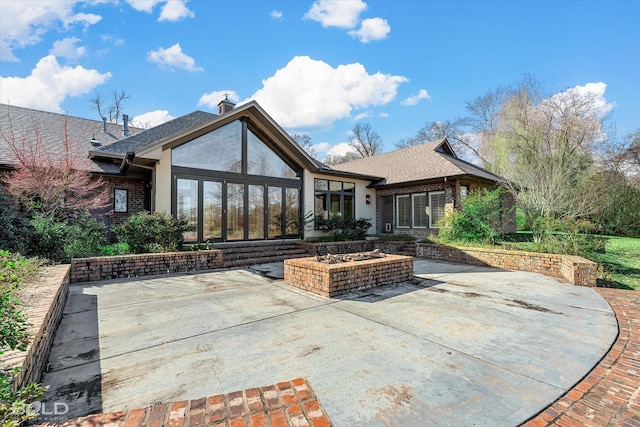 back of house with a patio area