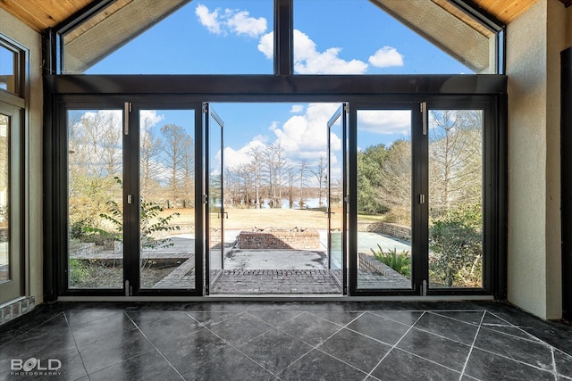 doorway with lofted ceiling