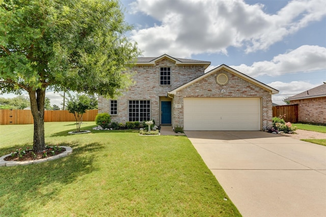 view of front of property with a garage and a front yard