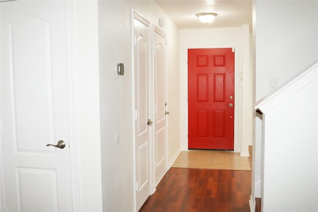 hallway with hardwood / wood-style flooring