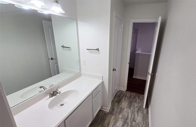 bathroom with vanity and hardwood / wood-style floors