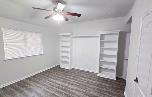 spacious closet featuring dark wood-type flooring, ceiling fan, and lofted ceiling