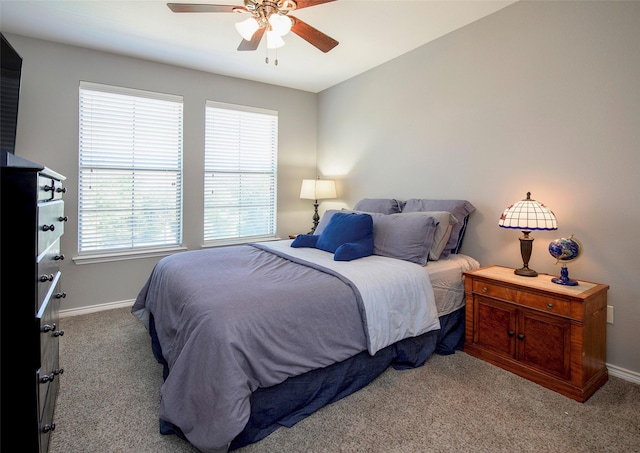 bedroom featuring ceiling fan and light colored carpet