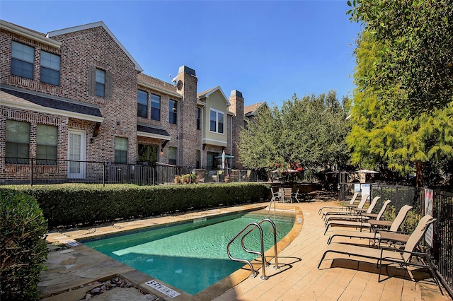 view of pool featuring a patio