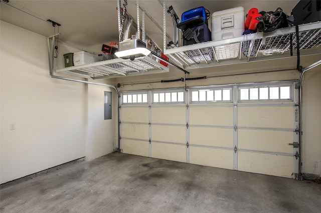 garage featuring a garage door opener and electric panel