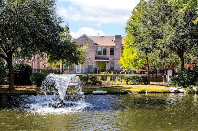 view of home's community featuring a water view