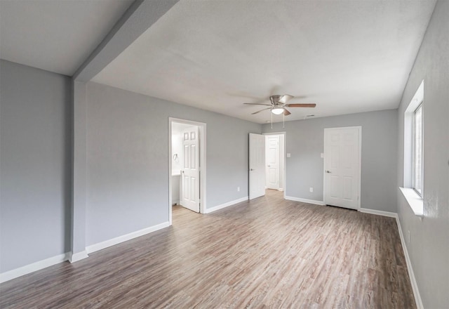 unfurnished room with hardwood / wood-style flooring and ceiling fan