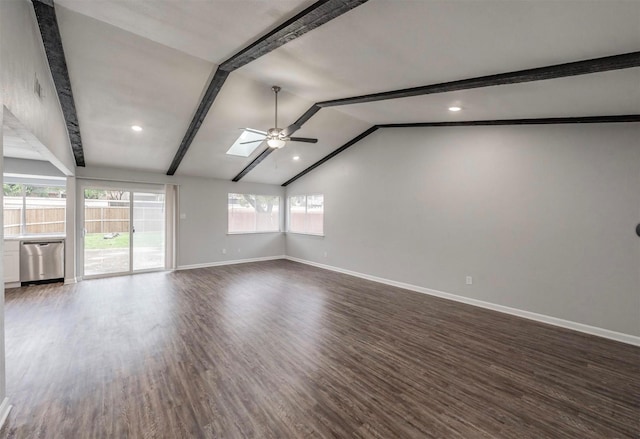 spare room featuring dark hardwood / wood-style flooring, lofted ceiling with skylight, and ceiling fan