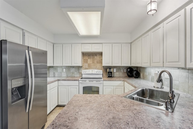 kitchen featuring stainless steel refrigerator with ice dispenser, sink, white range with electric cooktop, decorative backsplash, and white cabinets