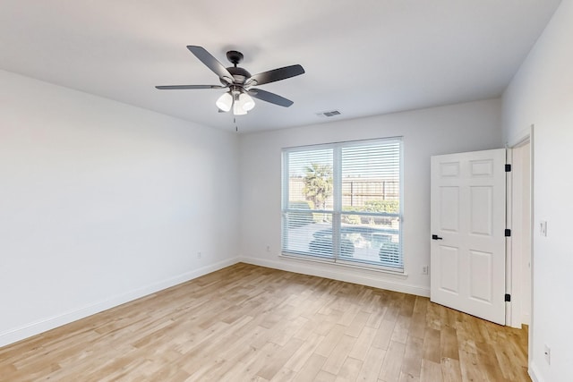 empty room with ceiling fan and light wood-type flooring