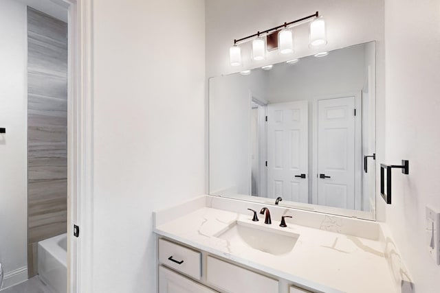 bathroom featuring vanity and a bathing tub