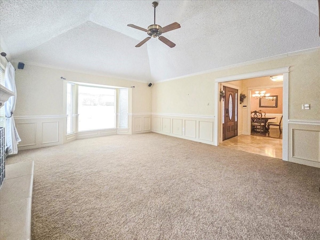 interior space with light carpet, lofted ceiling, and a textured ceiling