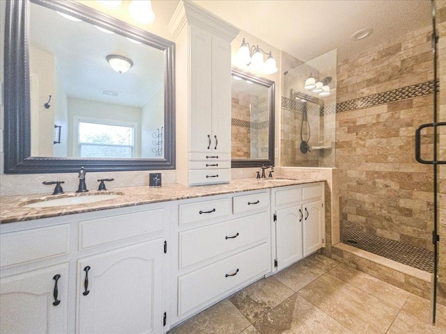 bathroom with vanity and walk in shower