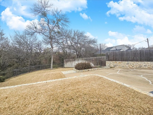 view of yard with basketball court