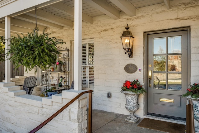 property entrance featuring a porch