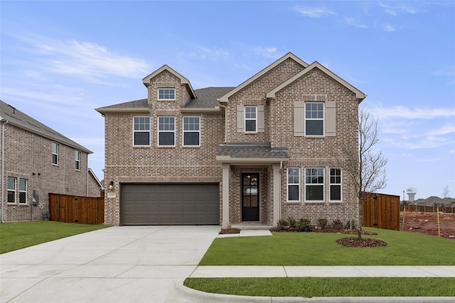 view of front of property featuring concrete driveway, brick siding, a front yard, and fence