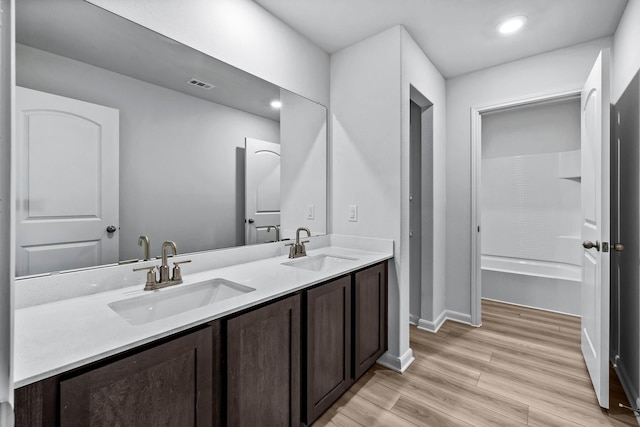 bathroom featuring vanity and wood-type flooring