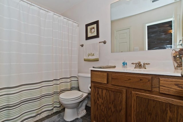 bathroom with vanity, tile patterned floors, and toilet