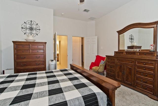 bedroom featuring light colored carpet and ceiling fan