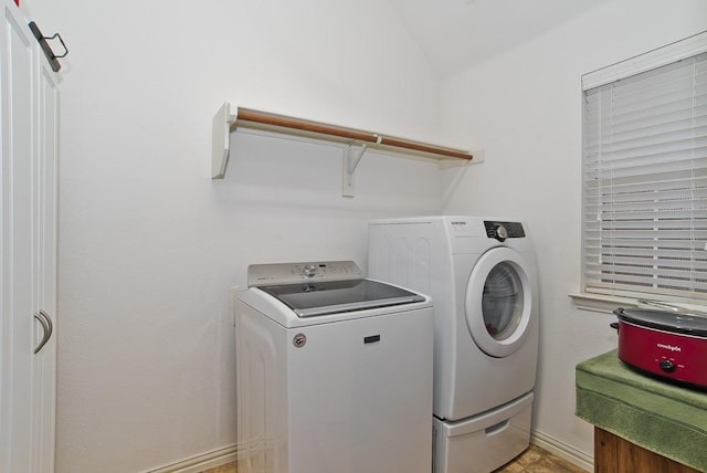 laundry area featuring washing machine and clothes dryer