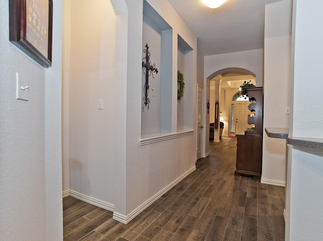 hallway with dark hardwood / wood-style floors